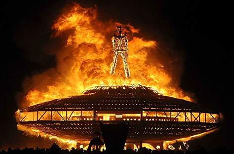 Burning Man festival attendee dies after running into flames image