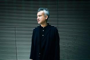 Satoshi Tomiie · Biography